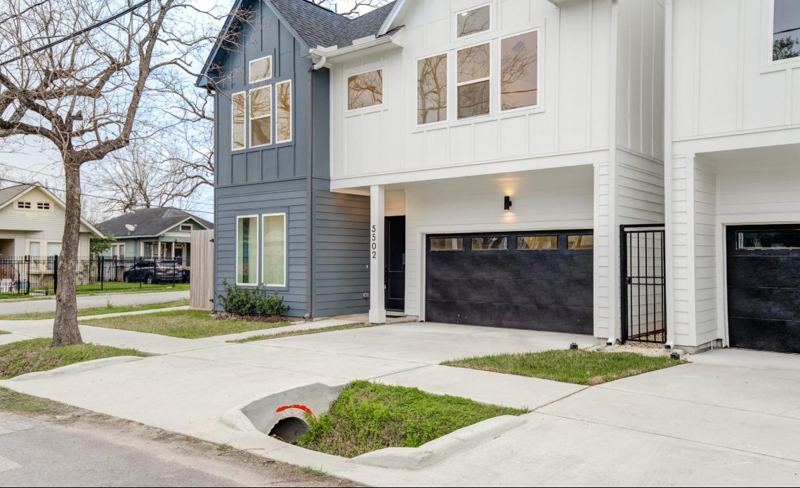 Front of 5502 Texas St, a two-story modern farmhouse-style home with a two-car garage