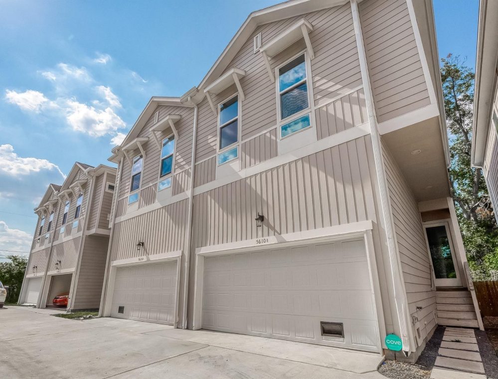 The leased townhomes at 5610 Patrick St, each with a two-car garage